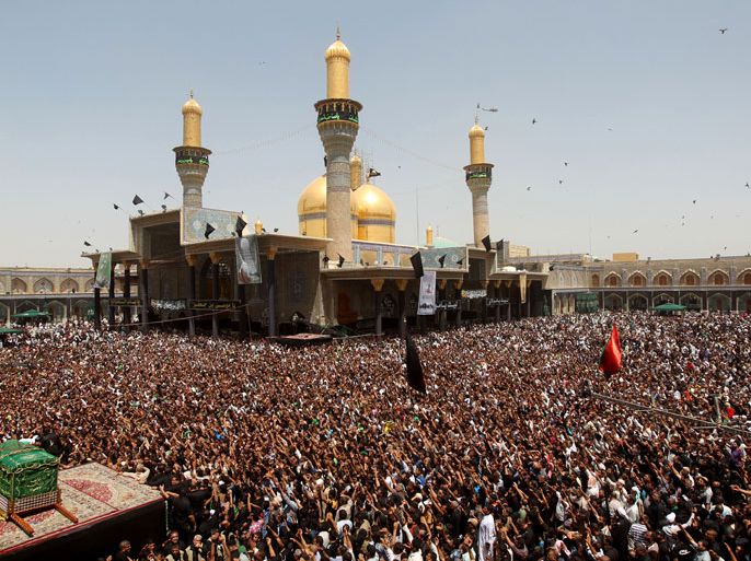 IRAQ : Iraqi Shiite Muslim worshipers gather at the shrine of Imam Musa al-Kadhim, to mark the anniversary of the death of the religious figure, in Baghdad’s northern district of Kadhimiya, on June 4, 2013. Pilgrims converge on the Imam's shrine to mark the death of the seventh Imam, who was imprisoned for four years and then poisoned by the then ruler Harun al-Rashid in 795.
