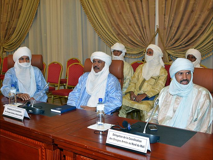 This photo taken on June 7, 2013 shows Taureg leaders waiting for a meeting to start on the Malian crisis in Ouagadougou. Talks between Malian authorities and armed ethnic Tuareg groups, who hold the northeastern town of Kidal, will get underway on June 8 after a day's delay, a source close to the Burkinabe mediators said. AFP PHOTO / AHMED OUOBA