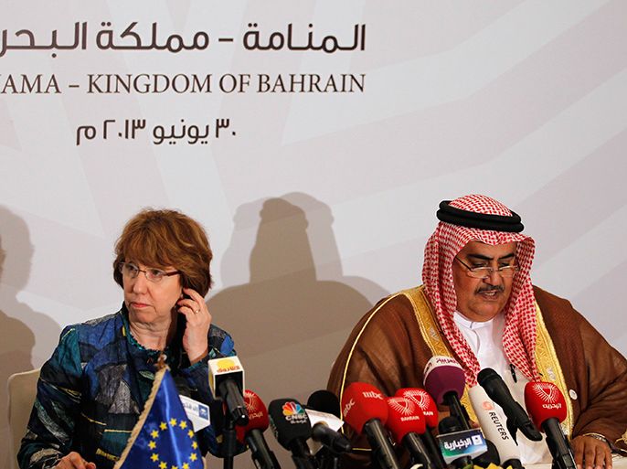 European Union foreign policy chief Catherine Ashton (L) listens as Bahraini Foreign Minister Sheikh Khalid bin Ahmed al-Khalifa speaks during a news briefing held after the 23rd EU-GCC Council and Ministerial Meeting in Manama June 30, 2013. REUTERS/Hamad I Mohammed (BAHRAIN - Tags: POLITICS)