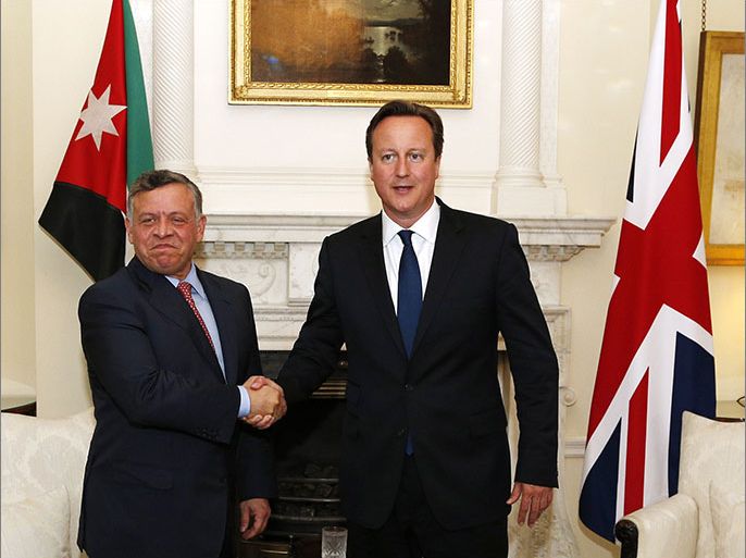 British Prime Minister David Cameron (R) meets with the Jordan's King Abdullah II in 10 Downing Street, London on June 19, 2013. AFP PHOTO / POOL / JONATHAN BRADY
