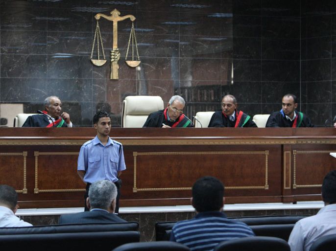 epa03211106 The Judge Amer al-Turki (3-R) is seen presiding the trial for men accused of being loyalist of the former Gaddafi regime, in a courtroom in Zawiyah, Libya, 08 May 2012. Libya organized the first trial for loyalists of the former Libyan leader Muammar Gaddafi. According to media sources, the judges decided to postpone the trial until next week. EPA/SABRI ELMHEDWI