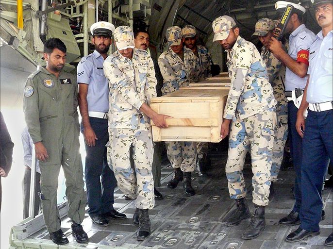 epa03756599 Pakistani Air Force officials carry a coffins containing the body of one of the foreign tourists upon their repatriation from Gilgit, at Chaklala Airbase in Rawalpindi, Pakistan, 23 June 2013. Islamist militants have killed ten foreigners, identified as five Ukrainians, three Chinese, a Russian and a Nepalese after attacking a camp on Nanga Parbat, the world's ninth highest peak in northern Pakistan. Pakistani Parliament passed a resolution to condemn the attack. EPA/MD NADEEM