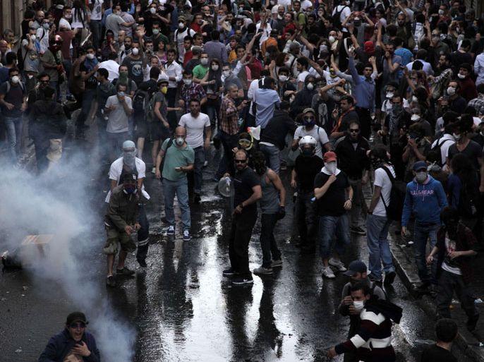 Istanbul, Istanbul, TURKEY : Protestors clash with Turkish riot policemen on May 31, 2013 during a protest against the demolition of the Taksim Gezi Park in Taksim Square in Istanbul. Police used tear gas to disperse a group, who were standing guard in Gezi Parki to prevent the Istanbul Metropolitan Municipality