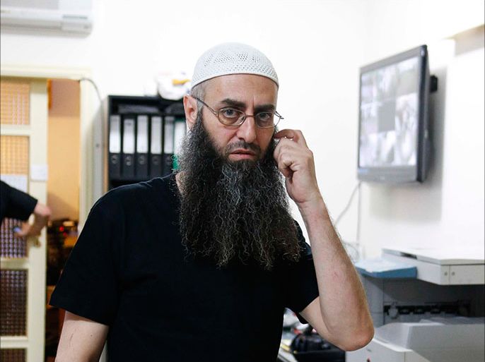 Sunni Muslim Salafist leader Ahmad al-Assir is pictured in his office in Sidon, southern Lebanon, June 18, 2013. Militants supporting opposing sides of Syria's civil war clashed in the southern Lebanese city of Sidon on Tuesday, killing one, a security source said, rocking a city where divisions have been simmering for months. In Sidon, supporters of ultra-conservative Sunni cleric Ahmad al-Assir shot machineguns and rocket-propelled grenades at the neighborhood of Abra, which is home to armed supporters of the Shi'ite militant group Hezbollah, an organization fighting for Assad in Syria, the source said.  REUTERS/Mohamed Azakir(LEBANON - Tags: POLITICS CIVIL UNREST)