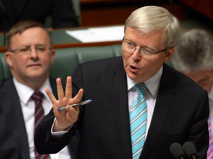 GW012 - Canberra, Australian Capital Territory, AUSTRALIA : Australian prime minister Kevin Rudd (C) speaks in parliament's House of Representatives in Canberra on June 27, 2013. Kevin Rudd called for a "kinder, gentler" approach to politics on June 27 after being sworn in as Australia's new prime minister almost three years to the day since he was ruthlessly ousted from the job by Julia Gillard. AFP PHOTO / Greg WOOD