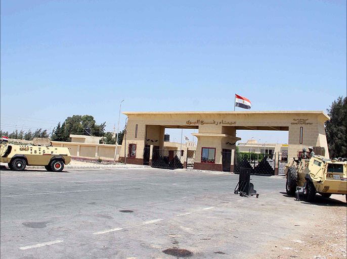 epa03344699 Egyptian army armored vehicles are seen next to the closed Rafah border crossing, one day after an attack on an Egyptian checkpoint in Rafah, Egypt, 06 August 2012. Media reports state that 16 Egyptian security forces were killed and seven others injured on 05 August when militants opened fire on a checkpoint and commandeered vehicles during a Ramadan fast in Rafah. Having hijacked the vehicles, they raced to the nearby Kerem Shalom/Karm Abu Salem crossing point on the Egypt-Israel-Gaza border. Egyptian authorities closed the border crossing with the Gaza Strip at Rafah indefinitely. EPA/AHMED KHALED