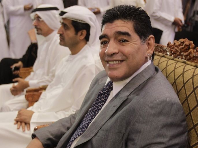 Argentina former soccer player and coach Diego Maradona, front, attends a press conference next to Ahmed Al Sharif, Secretary-General of Dubai Sports Council in which he has been appointed as Dubai's Honorary Ambassador of Sports in Dubai, United Arab Emirates Sunday, July 8, 2013.