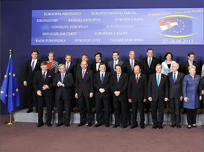 EUropean leaders pose during the family photo of the European Union leaders summit at the EU headquarters on June 27, 2013 in Brussels. European Commission President Jose Manuel Barroso on Thursday announced a political deal on the EU's hotly contested 2014-2020 trillion-euro budget, hours before an EU summit mulls how to get millions of jobless youths back into the workplace. AFP PHOTO / JOHN THYS