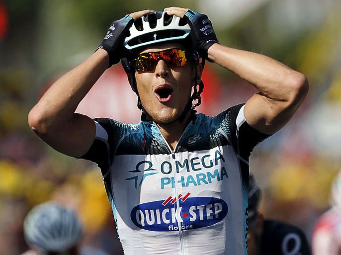 TOPSHOTSItaly's Matteo Trentin celebrates as he crosses the finish line at the end of the191 km fourteenth stage of the 100th edition of the Tour de France cycling race on July 13, 2013 between Saint-Pourcain-sur-Sioule and Lyon, central eastern France. AFP PHOTO / JEFF PACHOUD