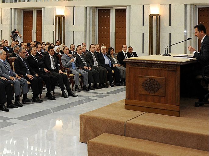 A handout picture released by the Syrian Arab News Agency (SANA) shows Syria's President Bashar al-Assad (R) heading the plenary meeting of the central committee of the ruling al-Baath party, in Damascus, on July 8, 2013. Syria's Baath party, headed by the country's embattled President, announced that its top leadership would be replaced, including Vice President Farouk al-Sharaa. AFP PHOTO / HO-SANA == RESTRICTED TO EDITORIAL USE - MANDATORY CREDIT "AFP PHOTO / SANA" - NO MARKETING NO ADVERTISING CAMPAIGNS - DISTRIBUTED AS A SERVICE TO CLIENTS ==
