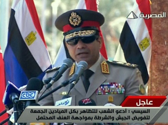 EGY01 - Cairo, -, EGYPT : An image grab taken from Egyptian state TV shows Egypt's army chief General Abdel Fattah al-Sisi giving a live broadcast calling for public rallies this week to give him a mandate to fight "terrorism and violence," as Mohamed Morsi's supporters continue to protest against his ouster. AFP PHOTO/EGYPTIAN TV == RESTRICTED TO EDITORIAL USE - MANDATORY CREDIT "AFP PHOTO / EGYPTIAN TV" - NO MARKETING NO ADVERTISING CAMPAIGNS - DISTRIBUTED AS A SERVICE TO CLIENTS ===
