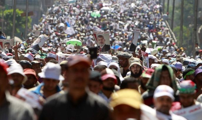 Supporters of deposed Egyptian President Mohamed Mursi shout slogans during a march from Al-Fath Mosque to the defence ministry, in Cairo July 30, 2013.
