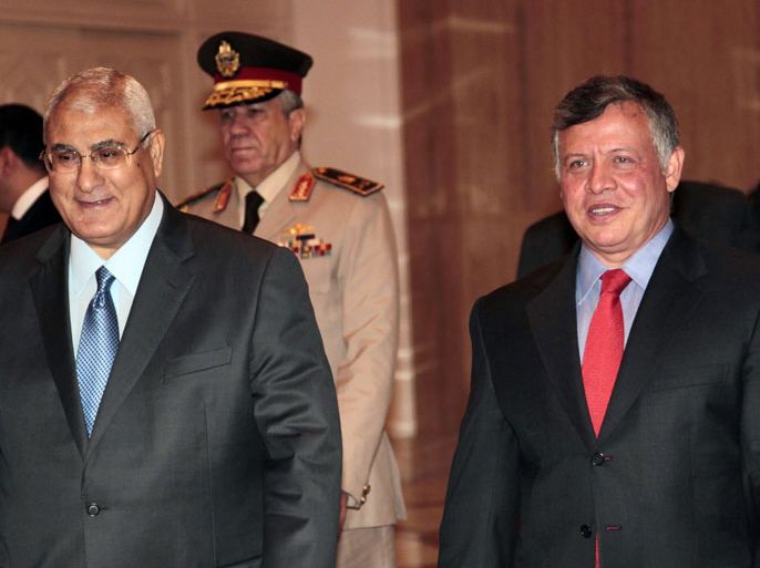 KD02 - Cairo, -, EGYPT : A handout picture released by the Jordanian Royal Palace shows Egypt's interim president Adly Mansour welcoming Jordan's King Abdullah II (R) before a meeting on July 21, 2013 in the Egyptian capital Cairo. The Jordanian monarch had been among the first leaders to congratulate Egyptians after the army overthrew Islamist president Mohamed Morsi following mass protests calling for him to resign. AFP PHOTO /JORDANIAN ROYAL PALACE/YOUSEF ALLAN