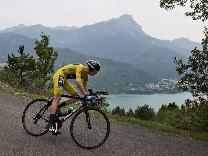 : Overall leader's yellow jersey Britain's Christopher Froome rides during the 32 km individual time-trial and seventeenth stage of the 100th edition of the Tour de France cycling race on July 17, 2013 between Embrun and Chorges, southeastern France. AFP PHOTO / JEFF PACHOUD