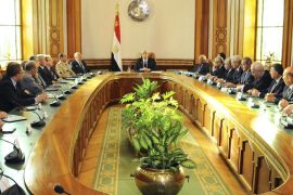 Egypt's interim President Adli Mansour (C) attends the first meeting with new government ministers at El-Thadiya presidential palace in Cairo in this handout picture dated July 16, 2013. Egypt's interim government sets about the mammoth task of returning the country to civilian rule and rescuing the economy on Wednesday, a process complicated by deadly protests and a political stalemate with powerful Islamist groups. Interim head of state Mansour, the burly judge leading the army-backed administration, swore in 33 mainly liberal and technocratic ministers at the presidential palace on Tuesday. Picture taken July 16, 2013. REUTERS/Egyptian Presidency/Handout (EGYPT - Tags: POLITICS MILITARY) ATTENTION EDITORS - NO SALES. NO ARCHIVES. THIS IMAGE WAS PROVIDED BY A THIRD PARTY. FOR EDITORIAL USE ONLY. NOT FOR SALE FOR MARKETING OR ADVERTISING CAMPAIGNS. THIS PICTURE IS DISTRIBUTED EXACTLY AS RECEIVED BY REUTERS, AS A SERVICE TO CLIENTS