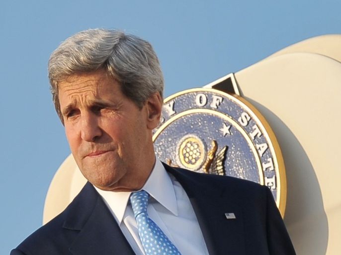 US Secretary of State John Kerry makes his way to board a plane on July 15, 2013 at Andrews Air Force Base in Maryland. Kerry is returning to Jordan on his sixth trip to the region as he tries to push Israelis and Palestinians back to peace talks.