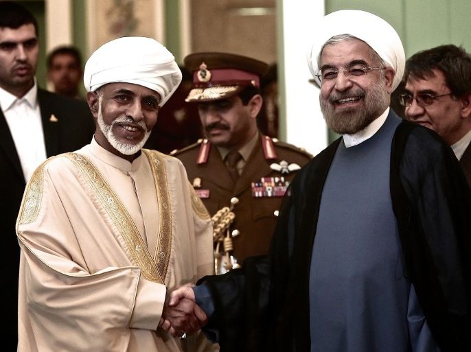 Iranian President Hassan Rowhani (R) poses for a picture with Oman's Sultan Qaboos bin Said (L) during the latter's welcoming ceremony at Tehran's Saadabad Palace on August 25, 2013. The Iranian authorities have announced that Sultan Qaboos of Oman, the only Gulf leader to maintain good relations with Tehran, arrived in Iran for a focus on economic issues and diplomacy visit.
