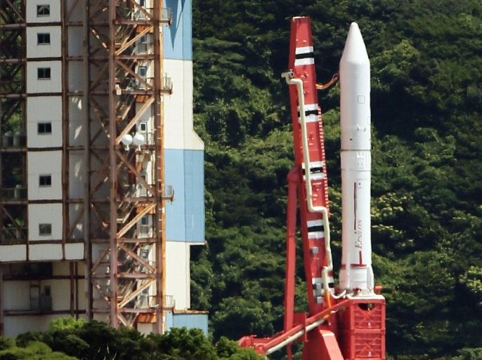 Japan Aerospace Exploration Agency's (Jaxa) new solid fuel rocket Epsilon stands on a launching pad at Jaxa's Uchinoura Space Center at Kimotsuki town in Kagoshima prefecture, Japan's southern island of Kyushu on August 27, 2013. Jaxa suspended its planned launch of the Epsilon rocket to send a telescope into orbit to study nearby planets at the last minutes.