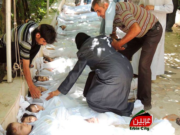 epa03832184 A citizen journalism image provided by the Local Committee of Arbeen shows the bodies of Syrian children after an alleged poisonous gas attack fired by regime forces, according to opposition activists, in Arbeen town, Damascus, Syria, 21 August 2013. Syrian opposition activists have
