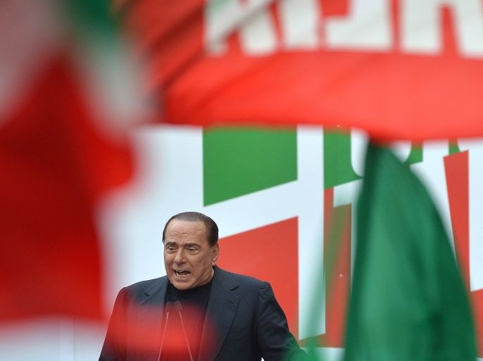 Former Italian premier Silvio Berlusconi attends a demonstration organized by the People of Freedom (PDL) party in his support, in front of his residence in Rome, on August 4, 2013. Berlusconi said today the government 'must forge ahead' amid high tension on the political scene after he was handed a prison sentence by the country's highest court.