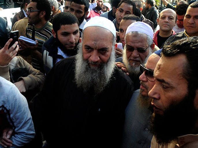 A photograph made available on 17 August 2013, shows Mohammed al-Zawahiri (C), brother of Ayman al-Zawahiri, the Chief of al-Qaeda, during a protest outside the French embassy in Cairo, Egypt, 18 January 2013. Egyptian police have arrested the brother of Ayman al-Zawahiri, security sources said on 17 August. Mohammed al-Zawahiri, a jihadist who was released from prison in 2011, was arrested at a security checkpoint in Giza, south of Cairo, the sources said. EPA/TAREK WAGUIH