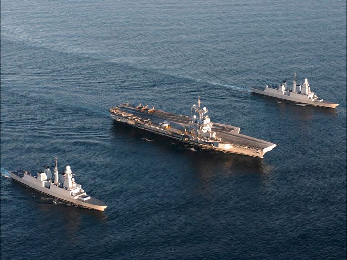 epa02983140 (FILE) A French Navy handout released on 20 April 2010 and reissued on 28 october 2011 shows an aerial view of aircraft carrier 'Charles De Gaulle' (C) between French Horizon Class Destroyers 'Forbin' (front) and 'Chevalier Paul' (back) at sea in an undisclosed location on 28 March 2010 during NATO maneuvers inside the Polar Arctic Circle. NATO's job in Libya 'is done,' NATO Secretary General Anders Fogh Rasmussen said on 28 October 2011, as he announced on twitter that military operations in the country would end on 31 October. EPA/MARINE NATIONALE / HANDDOUT EDITORIAL USE ONLY/NO SALES