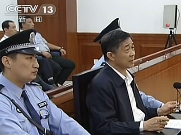 This screen grab taken from state television CCTV footage broadcast on August 25, 2013 shows ousted Chinese political star Bo Xilai (R) speaking in the courtroom as he stands trial at the Intermediate People's Court in Jinan, in eastern China's Shandong province. Fallen Chinese politician Bo Xilai accused his former police chief of being a liar and fraudster on August 25, the fourth day of a dramatic corruption trial that has gripped the nation. CHINA OUT AFP PHOTO