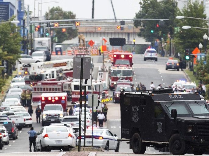 A Washington Police Emergency Response Team armored car (R) and other emergency vehicles fill M Street, Southeast, as they respond to a shooting at the Washington Navy Yard in Washington, September 16, 2013. Several people were killed and others were injured in the shooting at the Navy Yard in Washington D.C. on Monday.