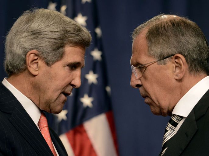 TOPSHOTSUS Secretary of State John Kerry (L) speaks with Russian Foreign Minister Sergey Lavrov (R) before a press conference in Geneva on September 14, 2013 after they met for talks on Syria's chemical weapons. Washington and Moscow have agreed a deal to eliminate Syria's chemical weapons, Kerry said after talks with Lavrov. AFP PHOTO/PHILIPPE DESMAZES