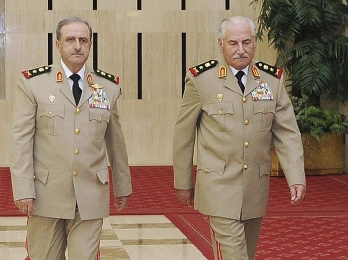 Syria's President Bashar al-Assad (R) waves as he arrives with Syrian Defense Minister General Ali Habib (C) and Chief of Staff General Dawoud Rajha to attend a dinner to honour army officers on the 65th Army Foundation anniversary in Damascus in this August 1, 2010 file photo. Former Syrian Defence Minister General Ali Habib, a prominent member of President Bashar al-Assad's Alawite sect, has defected and is now in Turkey, a senior member of the opposition Syrian National Coalition told Reuters on September 4, 2013.