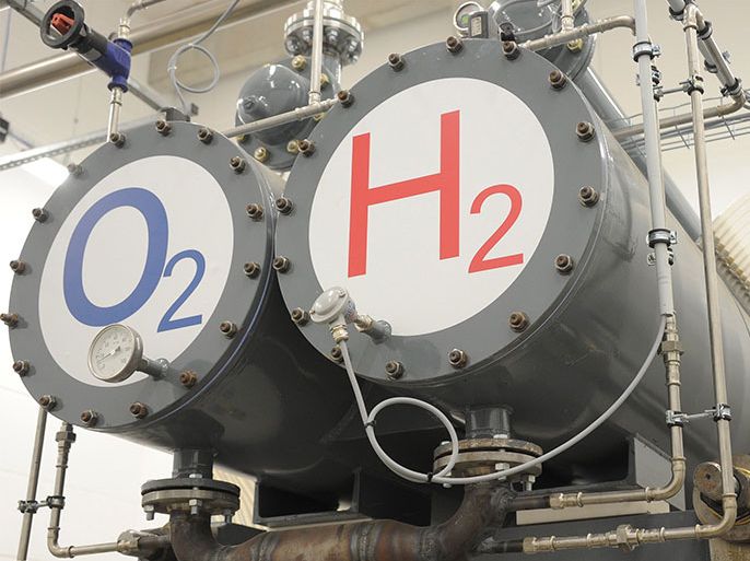 Two tanks marked with 'O2' for oxygene and 'H2' for hydrogene, part of the electrolysis installations, are seen at the first Hydrogene hybrid power plant that was inaugurated in Wittenhofe, near Prenzlau, Germany, on 25 October 2011. Powered by natural sources such as wind energy and bio gas the plant produces electricity and heat while an elektrolyzer uses exess energy to devide water into hydrogene and oxygene for storage. The stored hydrogene, in combination with bio gas can be burnt and re-converted into electrcity in case that the wind turbines are not producing enough energy. EPA/BERND SETTNIK