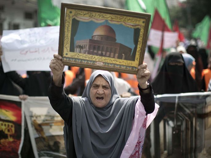 A Palestinian woman shouts slogans during a protest organised by the Hamas movement in Gaza City on September 24, 2013, amid recent tensions among Palestinians regarding Israel's admittance of visitors to a holy site in Jerusalem's Old City which houses the al-Aqsa mosque and the Dome of the Rock (photo) and which Jews revere as the vestige of their ancient temples. AFP PHOTO / MAHMUD