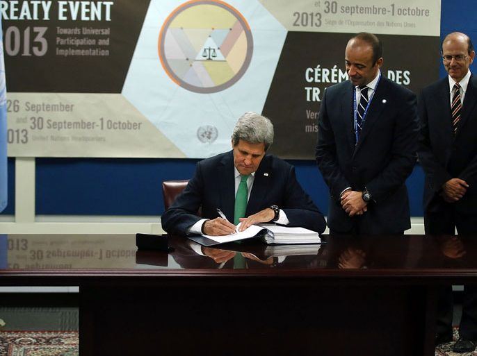 NEW YORK, NY - SEPTEMBER 25: U.S. Secretary of State John Kerry signs the U.N. Arms Trade Treaty, which seeks to regulate the $70 billion international conventional arms business on September 25, 2013 in New York City. Kerry signed the treaty during the annual U.N. General Assembly in New York. The treaty, which has been attacked by America's pro-gun National Rifle Association (NRA), will require ratification by the U.S. Senate to be implemented. Spencer Platt/Getty Images/AFP== FOR NEWSPAPERS, INTERNET, TELCOS & TELEVISION USE ONLY