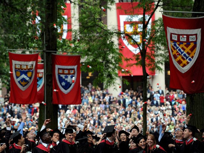 epa01369892 Graduates from Harvard Medical School throw large plastic pills into the air during Commencement exercises at Harvard University in Cambridge, Massachusetts, USA, 05 June 2008. British author J.K. Rowling received an honorary Doctor of Letters degree during the ceremony. EPA/MATT CAMPBELL