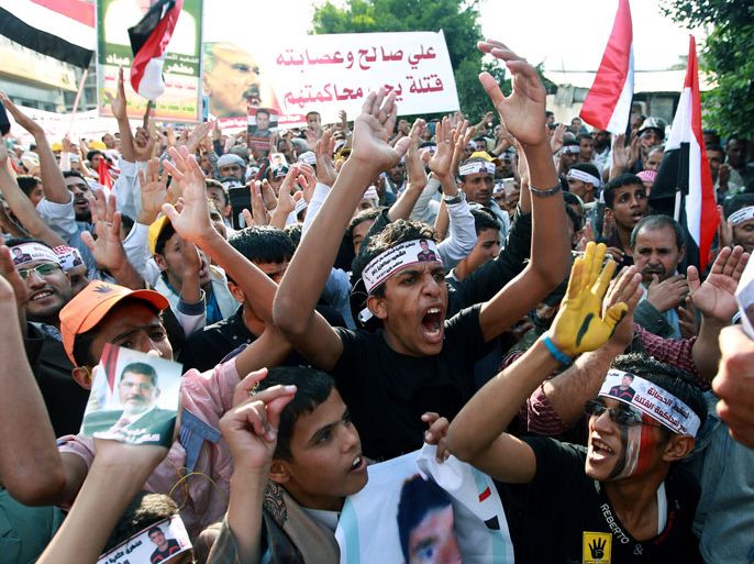 YEMEN : Yemenis shout slogans during a rally commemorating the second anniversary of a major clash between opposition protesters against former Yemeni president Ali Abdullah Saleh and security forces, in the capital Sanaa, on September 18, 2013. Thousands of Yemenis demonstrated to demand that ousted president Saleh be put on trial over killings during a year of protests against his rule. AFP PHOTO/ MOHAMMED HUWAIS