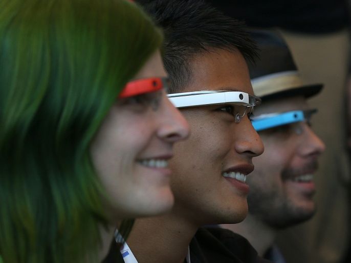 SAN FRANCISCO, CA - MAY 17: Attendees wear Google Glass while posing for a group photo during the Google I/O developer conference on May 17, 2013 in San Francisco, California. Eight members of the Congressional Bi-Partisan Privacy Caucus sent a letter to Google co-founder and CEO Larry Page seeking answers to privacy questions and concerns surrounding Google's photo and video-equipped glasses called 'Google Glass'. The panel wants to know if the high tech eyeware could infringe on the privacy of Americans. Google has been asked to respond to a series of questions by June 14.