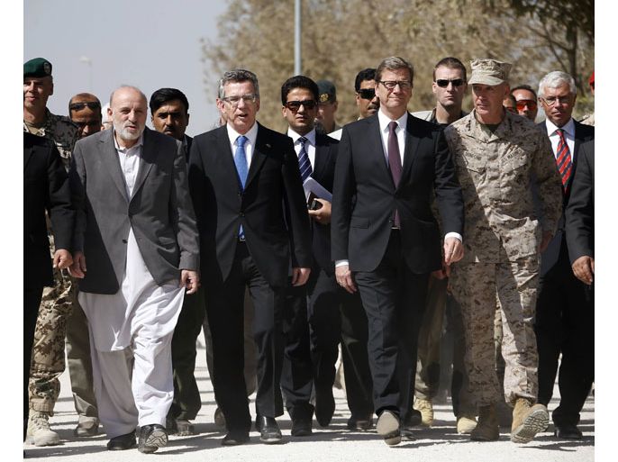 epa03899148 Afghan Interior Minister Mohammad Omar Daudzai (L-R), German Defence Minister Thomas de Maiziere, German Foreign Minister Guido Westerwelle and International Security Assistance Force (ISAF) Commander U.S. General Joseph Dunford arrive at the handover ceremony of a German base to Afghan armed forces in Kunduz, Afghansitan, 06 October 2013. Soldiers of the German contingency of the International Security Assistance Force (ISAF) withdrew from their base in Kunduz and the camp will be used by the Afghan National Army (ANA) and the Afghan National Civil Order Police (ANCOP). EPA/FABRIZIO BENSCH / POOL