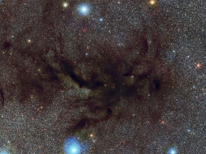 A handout image made available 15 August 2012 by European Southern Observatory, ESO, showing Barnard 59, part of a vast dark cloud of interstellar dust called the Pipe Nebula. This new and very detailed image of what is known as a dark nebula was captured by the Wide Field Imager on the MPG/ESO 2.2-metre telescope at ESO’s La Silla Observatory. The Pipe Nebula is a prime example of a dark nebula. Originally, astronomers believed these were areas in space where there were no stars. But it was later discovered that dark nebulae actually consist of clouds of interstellar dust so thick it can block out the light from the stars beyond. The Pipe Nebula appears silhouetted against the rich star clouds close to the centre of the Milky Way in the constellation of Ophiuchus (The Serpent Bearer). HANDOUT EDITORIAL USE ONLY.