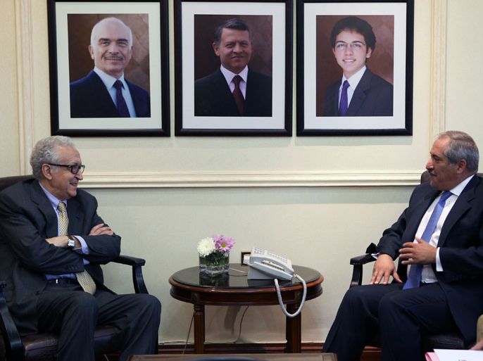 AMM02 - Amman, -, JORDAN : UN-Arab League envoy Lakhdar Brahimi Lakhdar Brahimi (L) meets with Jordanian Foreign Minister Nasser Judeh on October 23, 2013 in Amman. "The Syrian crisis is suffocating and dangerous. It threatens Syria and the entire region. It is the most dangerous to stability and security" Brahimi said during the meeting. AFP PHOTO/STR