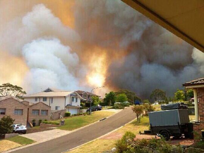 A photo made available by New South Wales emergency service shows a raging bushfire on Stapylton Street in Springwood, NSW, Australia 19 October 2013. Australian fire fighters are battling a series of major wildfires in the state, with fears that hundreds of homes have been destroyed EPA/NSW RURAL FIRE SERVICE AUSTRALIA AND NEW ZEALAND OUT