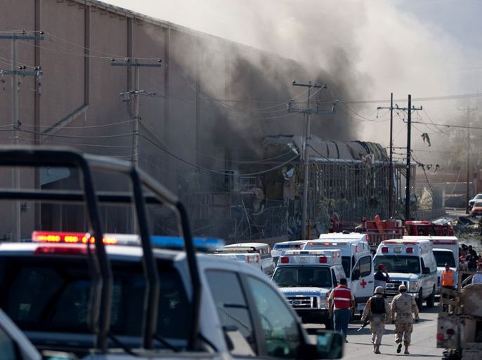 Smoke billows from a US-owned candy factory in Ciudad Juarez, in northern Mexico, after a boiler exploded on October 24, 2013. A huge blast rocked the Blueberry factory causing the ceiling to collapse, injuring more than 40 people and leaving 20 more missing, officials said