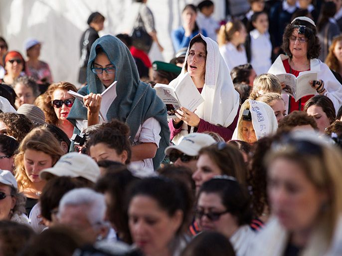 Members of "Women of the Wall" group wear prayer shawls during a monthly prayer session at the Western Wall in Jerusalem's Old City November 4, 2013