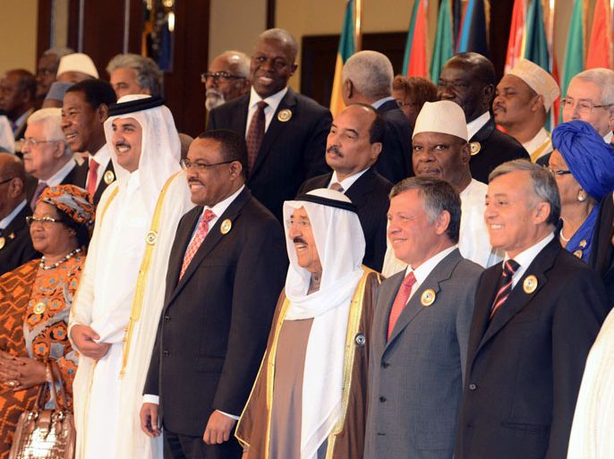 YAZ91 - Kuwait City, -, KUWAIT : Arab and African leaders pose for a group picture ahead of the Arab-African summit at Bayan Royal Palace in Kuwait city on November 17, 2013. The heads of state are set to review steps to promote economic ties between wealthy Gulf states and investment-thirsty Africa. AFP PHOTO/YASSER AL-ZAYYAT