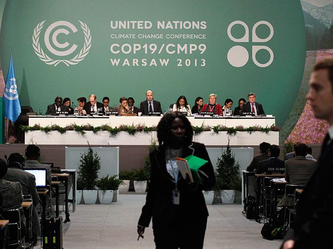 Delegates attend the closing session of the 19th conference of the United Nations Framework Convention on Climate Change