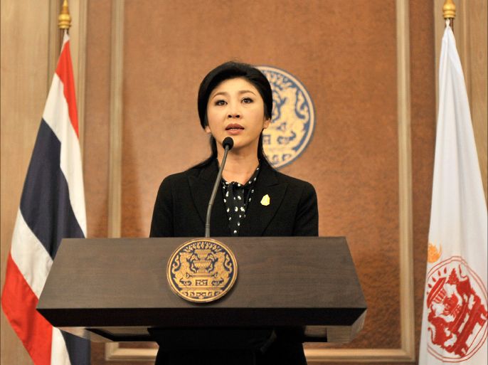 epa04000780 A handout picture provided by the Thai government shows caretaker Thai Prime Minister Yingluck Shinawatra addressing an assembly in Bangkok, Thailand, 25 December 2013. Yingluck proposed the formation of a 499-member reform