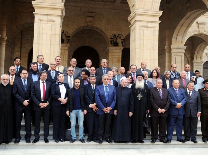 epa03974698 The Egyptian 50-member comittee tasked with completing the draft costitutional charter of the country, pose for a group photograph upon the approval of the draft, outside the Shoura Council, Cairo, Egypt, 02 December 2013. An Egyptian commission gathering 50 members, charged with rewriting the constitution, on 02 December, approved the draft charter, the first major step in the country's military-backed transitional road map, reported state television. The panel's head Amr Moussa is to present on 03 December the document to interim President Adly Mansour to call for a public referendum on it, said state media. EPA/FOUAD EL GUERNOUSSI/ALMASRY ALYOUM EGYPT OUT