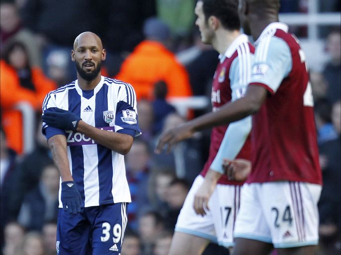 West Bromwich Albion's French striker Nicolas Anelka gestures as he celebrates scoring their second goal during the English Premier League football match between West Ham United and West Bromwich Albion at The Boleyn Ground, Upton Park in east London on December 28, 2013. The game finished 3-3. AFP PHOTO / IAN KINGTON