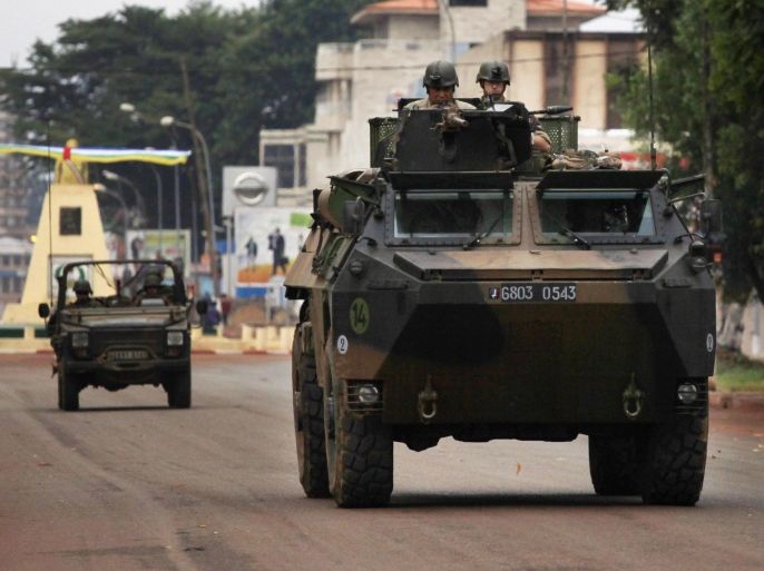 French troops patrol in an armored vehicle in Bangui, Central African Republic, December 6, 2013. France launched its second major African intervention in a year on Friday as its troops rushed to the Central African Republic's capital, Bangui, to stem violence that already claimed over 100 lives this week. REUTERS/Emmanuel Braun (CENTRAL AFRICAN REPUBLIC - Tags: MILITARY POLITICS CIVIL UNREST)