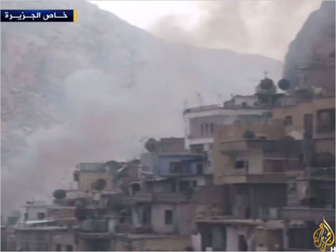 ‪المعارك في معلولا بريف دمشق ما زالت متواصلة بين النظام والمعارضة‬ (الجزيرة)