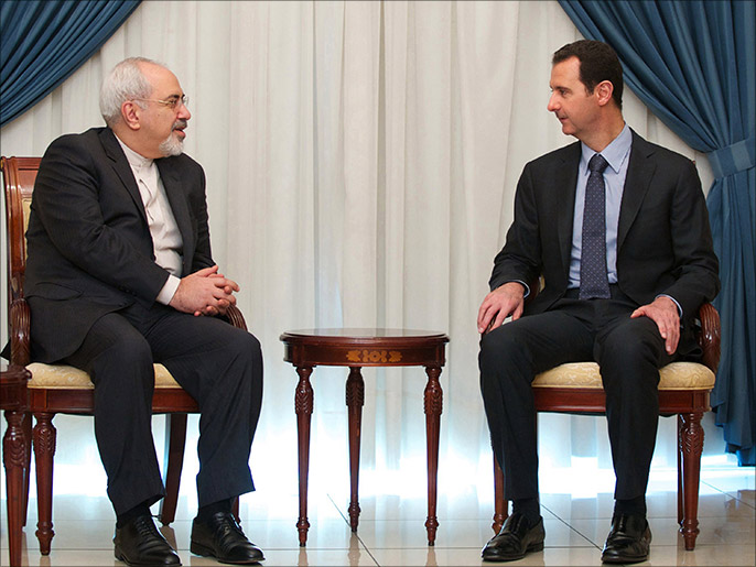 ظريف التقى الأسد في دمشق أمس (الفرنسية)